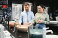 Couple choosing bathroom sink in plumbing store - PhotoDune Item for Sale