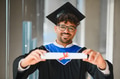 Happy arab student showing university diploma at graduation ceremony - PhotoDune Item for Sale