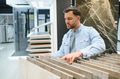 Customer choosing ceramic tiles in hardware store - PhotoDune Item for Sale