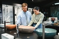 Couple exploring modern bathroom fixtures in store - PhotoDune Item for Sale