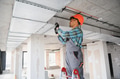 Arab engineer installing air conditioning system on construction site - PhotoDune Item for Sale