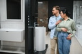 Couple choosing bathroom fixtures in plumbing store - PhotoDune Item for Sale