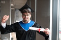 Happy arab student celebrating graduation with diploma and mortarboard - PhotoDune Item for Sale