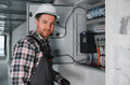 Electrician working on control panel in building under construction - PhotoDune Item for Sale