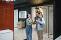 Family choosing bathroom fixtures in a showroom - PhotoDune Item for Sale