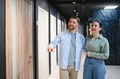 Couple choosing interior wooden door in furniture store - PhotoDune Item for Sale