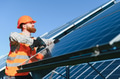 Worker installing solar panels in solar power station - PhotoDune Item for Sale