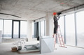 Construction worker installing ventilation system in building - PhotoDune Item for Sale
