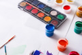 Artist workplace, set of color paints on wood desk - PhotoDune Item for Sale