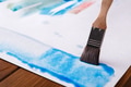 Brush in hands. Artist creating watercolor painting - PhotoDune Item for Sale