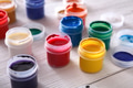 Artist workplace, set of color paints on wood desk - PhotoDune Item for Sale