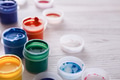 Artist workplace, set of color paints on wood desk - PhotoDune Item for Sale
