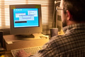 Middle Aged Caucasian Man Using Desktop Computer While Installing Software - PhotoDune Item for Sale