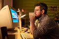 Caucasian Adult Man Using Desktop Computer in Home Office Setting - PhotoDune Item for Sale