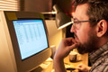 Caucasian Man Analyzing Spreadsheet Data on Desktop Computer Screen - PhotoDune Item for Sale
