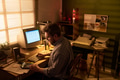 Caucasian Man Working with Vintage Computer and Calculator Indoors - PhotoDune Item for Sale