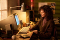 Caucasian Woman Working at Desk with Vintage Computer at Home - PhotoDune Item for Sale
