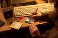 Woman Labeling Floppy Disks Beside Computer Keyboard - PhotoDune Item for Sale