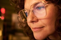 Portrait of Caucasian Woman Smiling While Looking at Computer Screen - PhotoDune Item for Sale