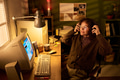 Caucasian Woman Enjoying Music While Sitting at Vintage Computer - PhotoDune Item for Sale