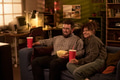 Caucasian Man and Caucasian Woman Watching Movie and Eating Popcorn - PhotoDune Item for Sale