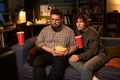 Caucasian Couple Watching Movie and Eating Popcorn Together - PhotoDune Item for Sale
