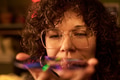 Portrait of Caucasian Woman Examining Optical Disc Indoors - PhotoDune Item for Sale