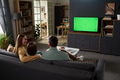 Family Relaxing Together Watching Television in Modern Living Room - PhotoDune Item for Sale
