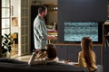Man Explaining Television Static to Wife and Child - PhotoDune Item for Sale