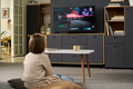 Young Girl Sitting on Floor Watching Video Game Victory Screen - PhotoDune Item for Sale