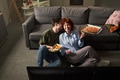 Young Man Whispering to Young Woman Eating Pizza Indoors - PhotoDune Item for Sale