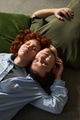 Young Couple Relaxing Together Indoors - PhotoDune Item for Sale