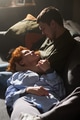 Young Woman Lying on Sofa Embracing Young Man - PhotoDune Item for Sale