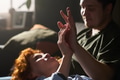 Young Couple Relaxing Together and Touching Hands in Sunlit Room - PhotoDune Item for Sale