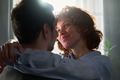 Young Woman Embracing Young Man Indoors Smiling - PhotoDune Item for Sale