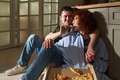 Young Couple Sitting on Kitchen Floor Sharing Pizza and Smiling - PhotoDune Item for Sale