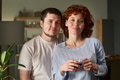 Portrait of Young Couple Smiling Together Enjoying Morning Beverage - PhotoDune Item for Sale