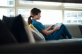 Woman Choosing Movie For Streaming On Tablet - PhotoDune Item for Sale