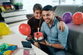 Couple Celebrating Birthday Party Doing Video Call On Phone - PhotoDune Item for Sale