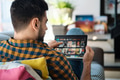 Man Choosing Movie For Streaming On Tablet - PhotoDune Item for Sale