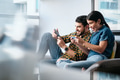 Young Couple Playing Video Game on Phone at Home - PhotoDune Item for Sale
