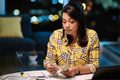 Woman doing home budget at night - PhotoDune Item for Sale