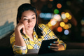 Woman Reading Ebook On Sofa at Night - PhotoDune Item for Sale
