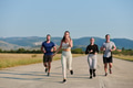 A group of friends maintains a healthy lifestyle by running outdoors on a sunny day, bonding over - PhotoDune Item for Sale