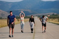 A group of friends maintains a healthy lifestyle by running outdoors on a sunny day, bonding over - PhotoDune Item for Sale