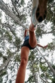 Adventurous Woman Overcoming Forest Obstacles with Determination and Agility. - PhotoDune Item for Sale