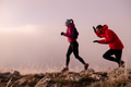 trail running couple man and woman running on a mountain path - PhotoDune Item for Sale