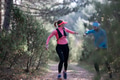 trail running with a sporty couple in the magic forest in early morning - PhotoDune Item for Sale