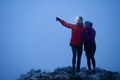 Runners tired of breathing after training look at their tech sports smart watch in night on maintain - PhotoDune Item for Sale