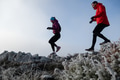 Athlete couple trail running on the mountain top in the early morning. Sky running concept - PhotoDune Item for Sale